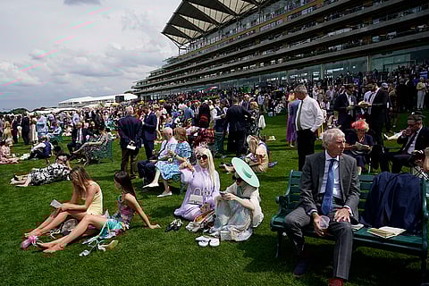 Racegoers watch the first race
